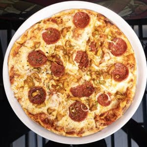 Pork Picante pizza with Spicy chorizo, green apple and chilli, onion, mozzarella and tomato sauce
